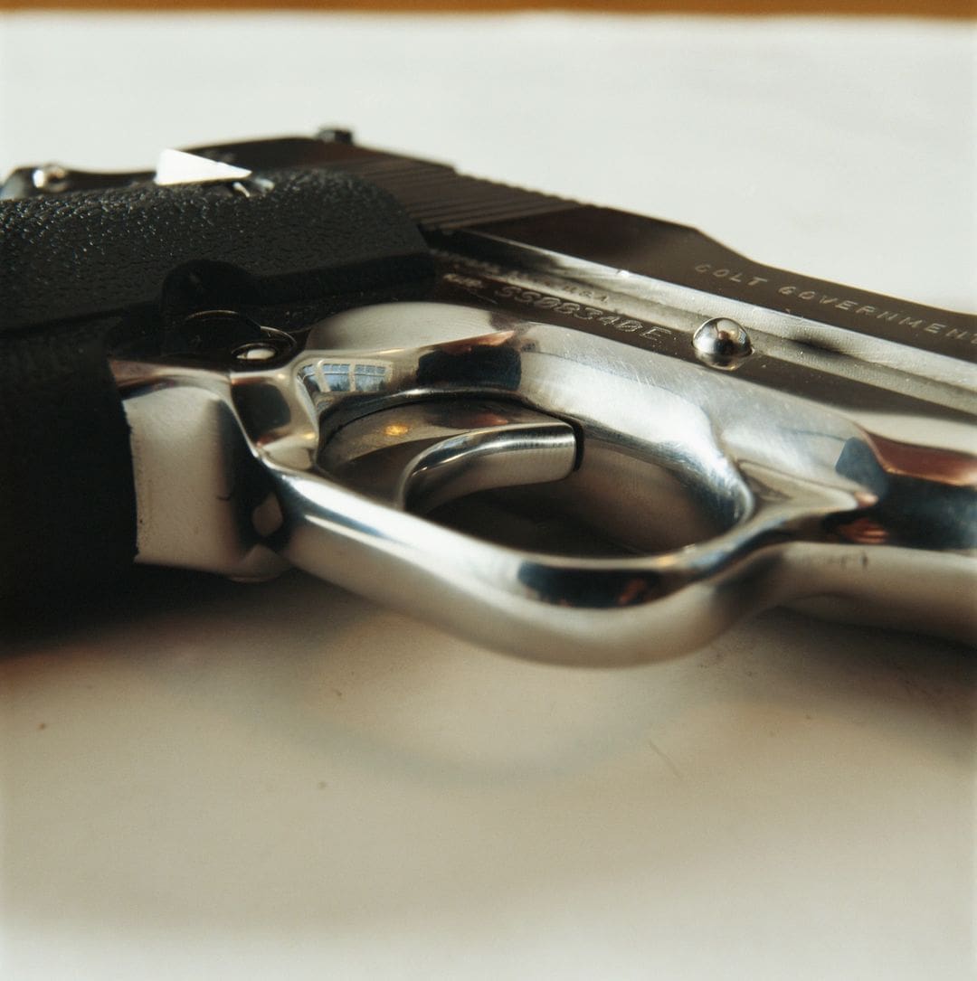 A close up of the trigger on a gun