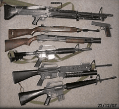A group of guns that are on the ground.