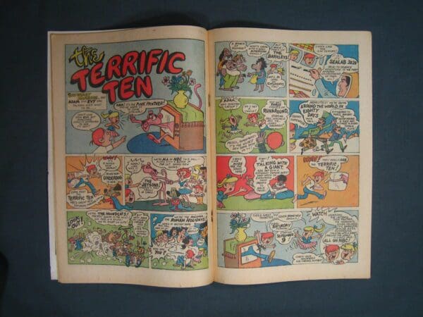 An open comic book displaying colorful panels from Marvel Spotlight #8 storyline.