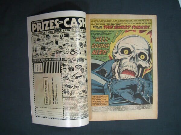Vintage Ghost Rider #9 comic book open to a page featuring an advertisement on the left and the title "Ghost Rider #9" with an illustration of a skeletal figure on the right.