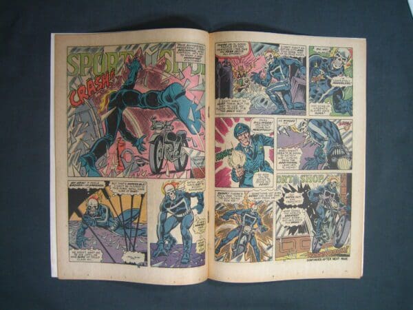 Vintage Ghost Rider #9 comic book open to a colorful page with action sequences.