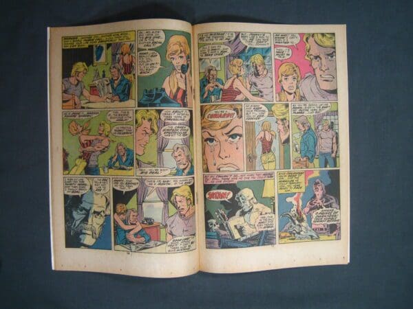 An open Ghost Rider #10 vintage comic book displaying colorful panels with various characters and speech bubbles.