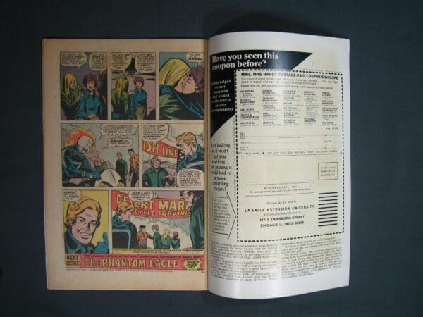 Open vintage comic book displaying a colorful page of the "Ghost Rider #11" story on the left and an advertisement with a mail-in coupon on the right.