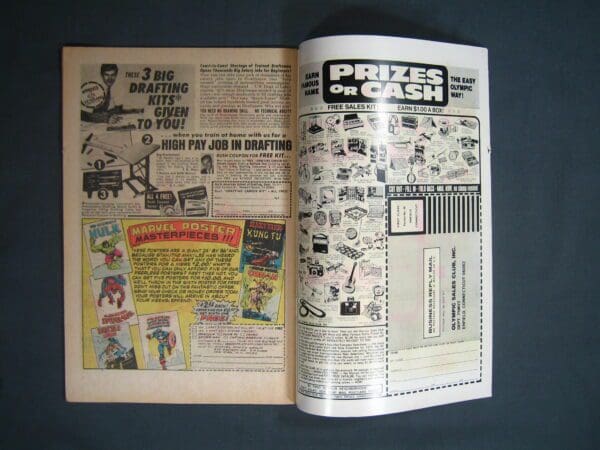 An open Ghost Rider #12 comic book displaying classic advertisements on its pages.