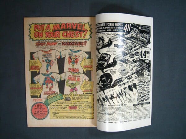 Vintage Ghost Rider #13 comic book showing an advertisement page with superhero merchandise and fishing equipment.